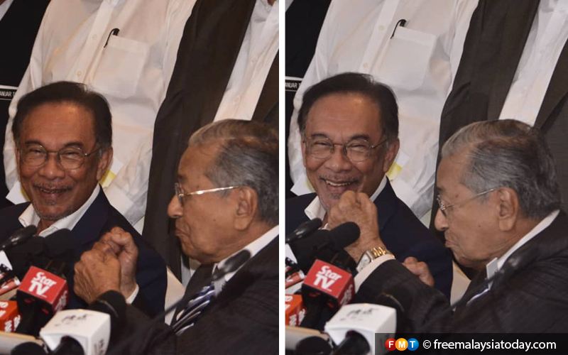 Want to fight? Mahathir jokingly puts up his fists at Anwar