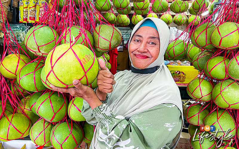 Pomelo seller is all smiles despite uncertain future FMT