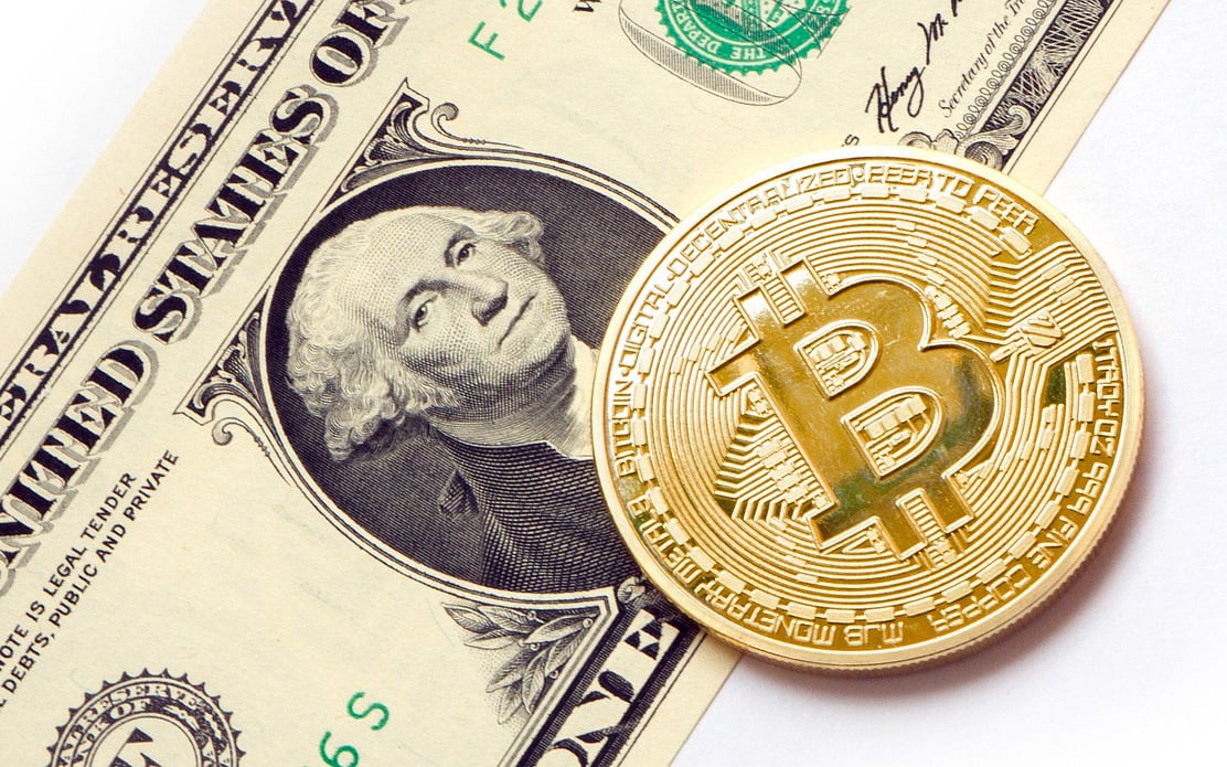 Dollar eases as Fed clues awaited, bitcoin hits 2-year high