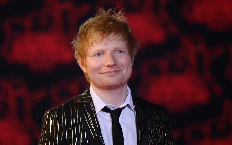 Ed Sheeran strums guitar, sings at copyright trial