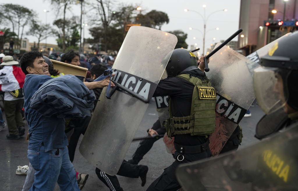 Peruvian cops clash with protesters demanding president quit