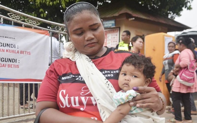 Baby comes too as Orang Asli mother goes to vote