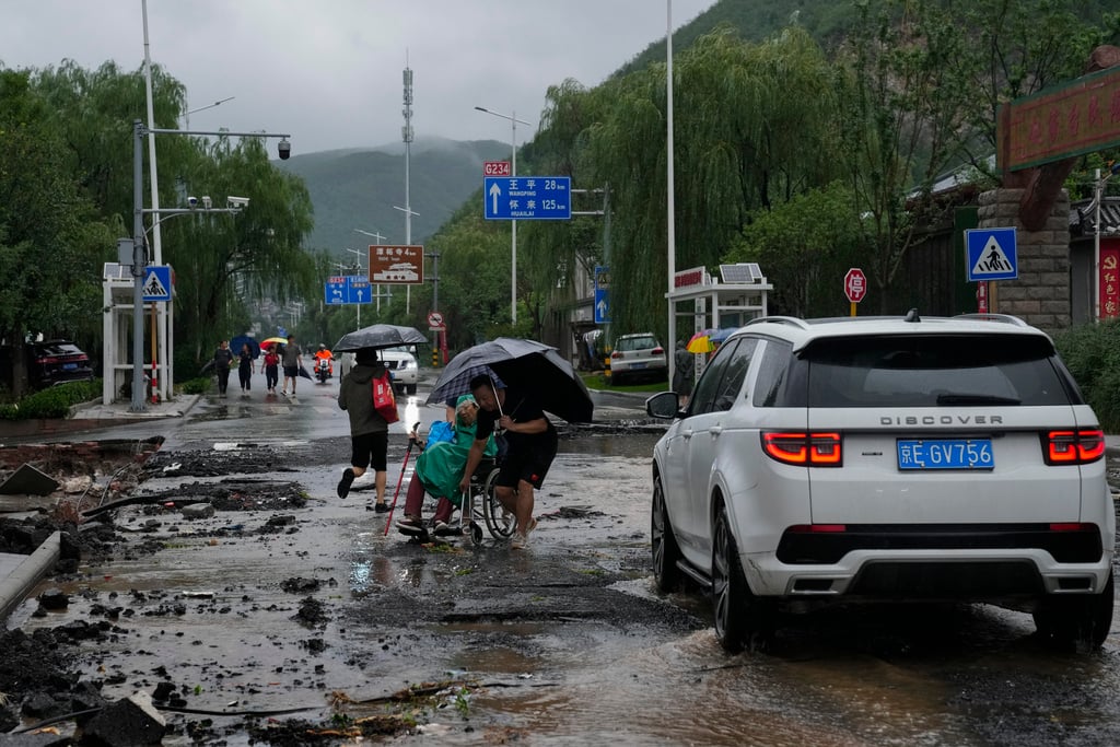 Flooded rivers, trapped residents test China’s disaster response