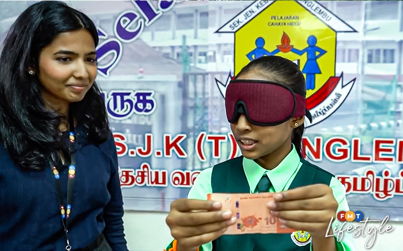 Perak girl breaks Guinness World Record in blindfolded chess set