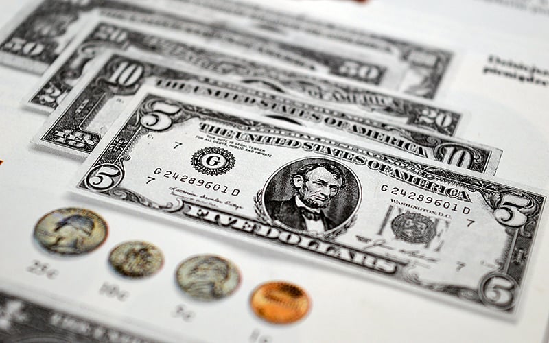 Dollar sinks to 4-month low ahead of US inflation test