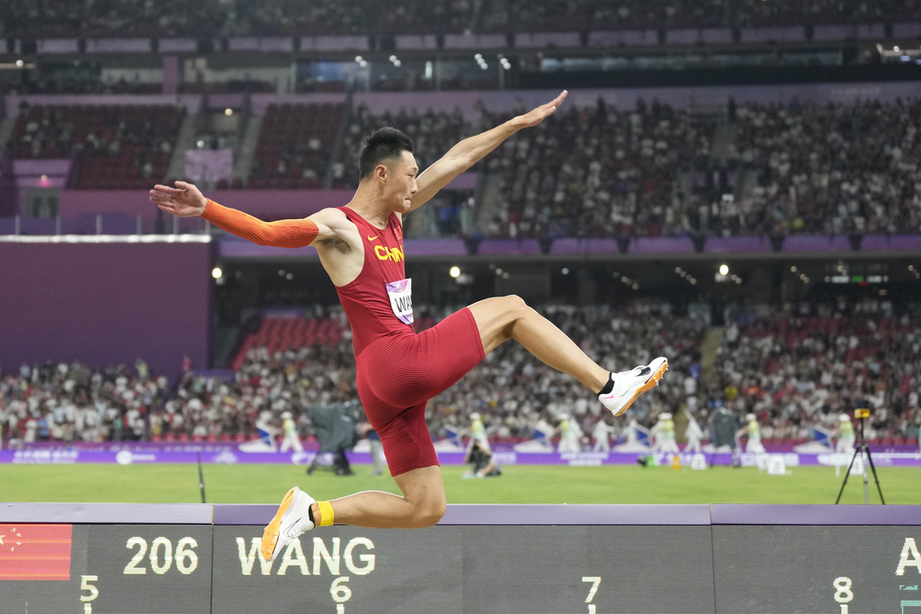 China thrill in track and field but footballers flop again at Asiad