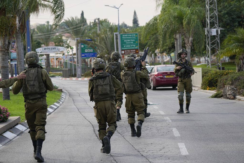 Israelis in shock as Hamas gunmen raid homes, take captives