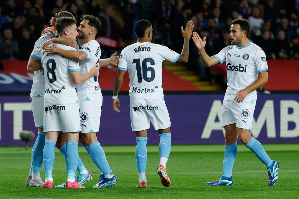 Girona go top despite stumble at winless Almeria