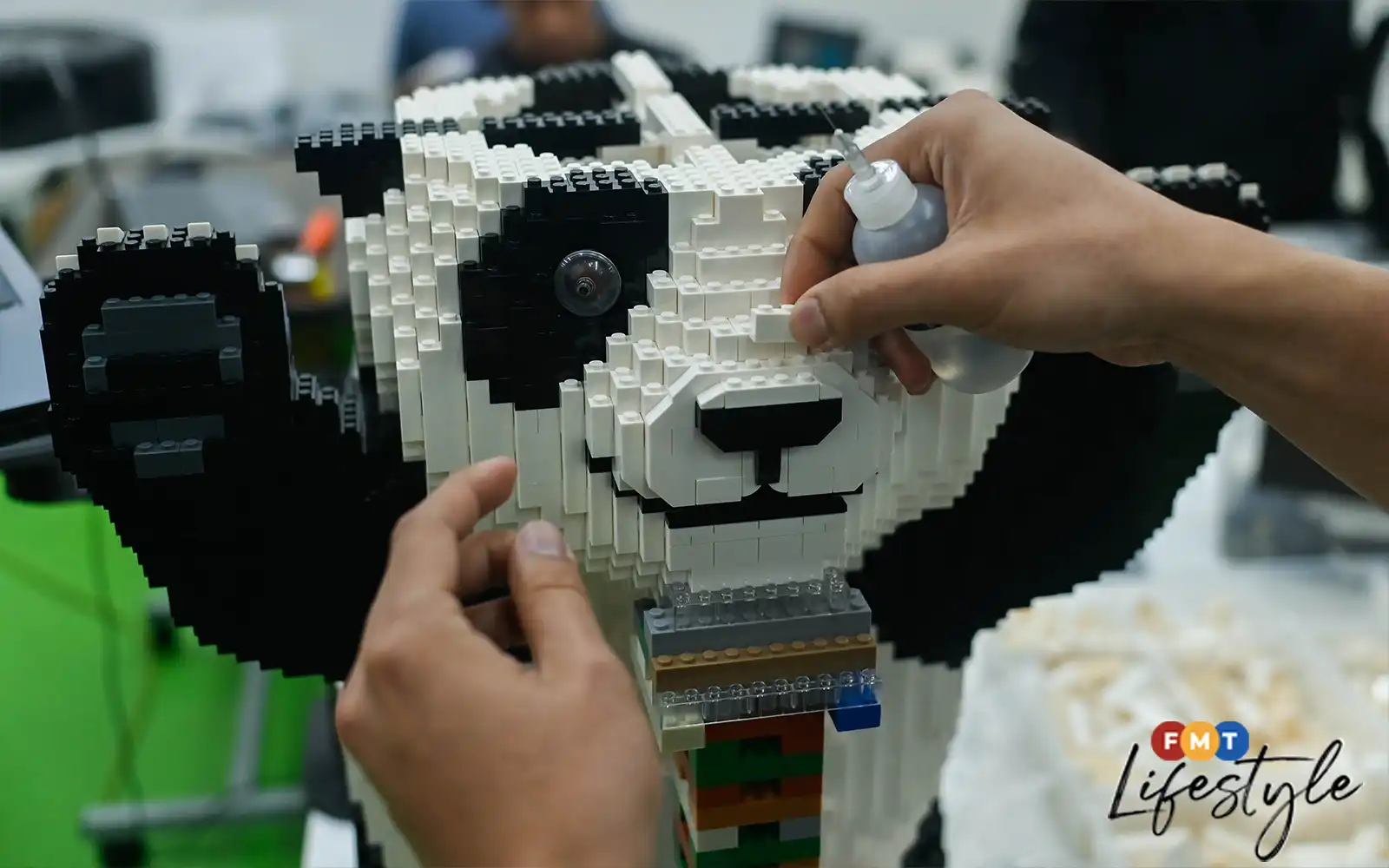 Cute pandas in life-size Myvis, all made brick by brick