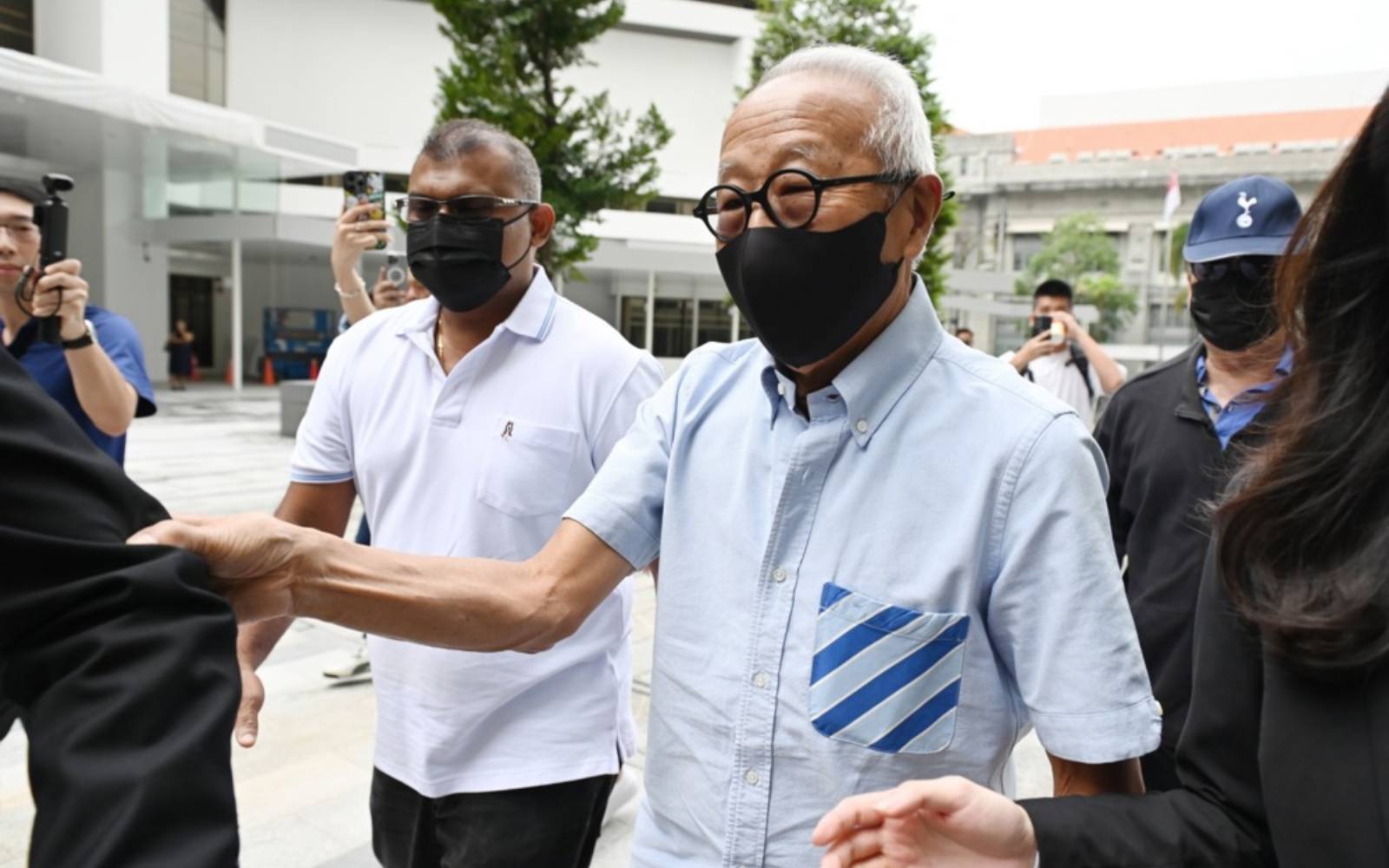 Singapore property tycoon linked to jailed minister pleads guilty