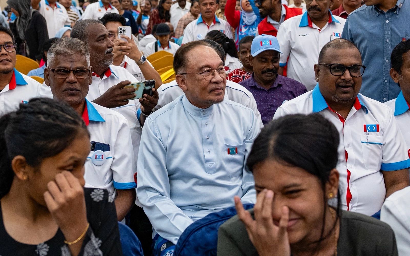Anwar Ibrahim is seen seated among ordinary members-